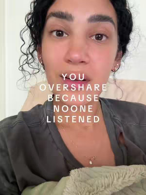 A selfie-style image featuring a person with dark curly hair, looking directly at the camera. Text overlayed centers on sharing and perception. The person is wearing a gray top, and the background appears to be a soft-colored space, suggesting an indoor setting.