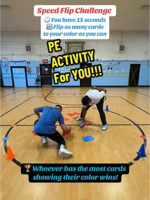 Two men in a gymnasium are engaged in a physical challenge, kneeling on the floor and flipping colored cards within a marked circle. Text overlays indicate the nature of the challenge: a speed flip competition to see who can flip the most cards to their color within 15 seconds.