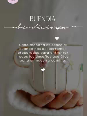 The image features a white mug held by two hands, set against a soft, neutral background. Overlaying the image are text elements in a graceful script style, centered at the top and containing a quote. The overall composition conveys a message of positivity and morning greetings.