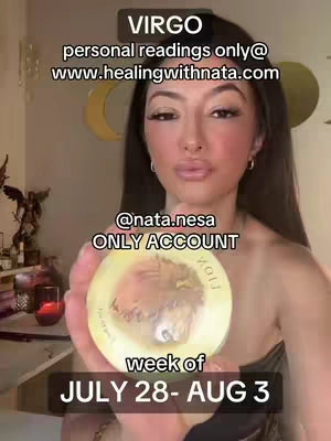 A woman with long dark hair, wearing a black top, holds a golden circular object with an image in the center. Text overlays at the top announce "VIRGO" and provide website/social media information. Additional text along the bottom indicates "week of JULY 28-AUG 3". The background includes soft lighting and hints of decorative elements.