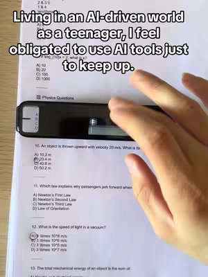 The cover image shows a close-up of a physics test paper with multiple-choice questions. A hand is holding an exam reader over the questions. Overlaid on top is the text “Living in an AI-driven world as a teenager, I feel obligated to use AI tools just to keep up.”