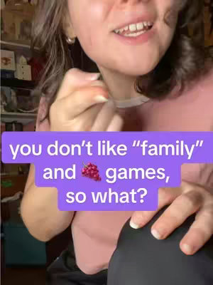 A close-up shot of a person, likely a female, showing the lower part of their face, with visible lips, teeth and a slight smile. The background is blurred, with a purple rectangle on the cover with white text overlayed.