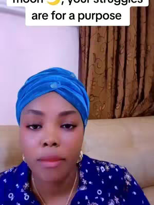 A woman with a blue head wrap and a patterned blue shirt is looking directly at the camera. Text overlays the top of the image.