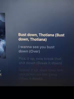 The cover image displays text from the lyrics of a song against a dark background. The text is broken up into lines, with some parenthetical notes. The left has a blurry, indistinct element which might be an image related to the song.