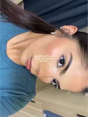 The cover image is a close-up shot of a person, likely a woman, facing slightly to the left, with dark hair pulled back. The person has visible makeup, and the shot focuses on the face, highlighting the eyes and lips. The background is blurred, but appears to be a blue-gray surface. Text overlayed on the image indicates the product is a face powder.