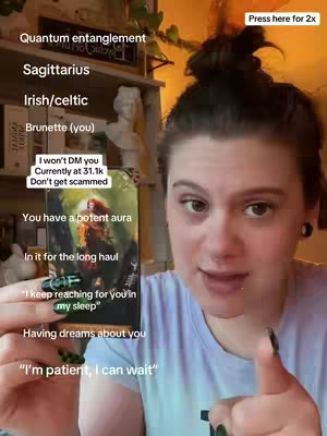 A woman with dark hair in a bun holds up a tarot card, smiling and speaking in front of a bookshelf. Text overlays on the image provide information on readings.