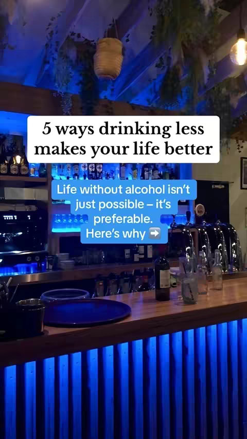 The cover image shows the interior of a bar with a sign that has the text "5 ways drinking less makes your life better"  in a white box, with the rest of the text "Life without alcohol isn't just possible - it's preferable. Here's why ->"  in a connected blue box. The bar has a wooden counter and a blue neon light in front of the bar. In the background behind the text box are some liquor bottles and a bar shelf.