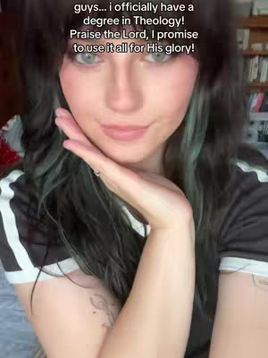 A young woman with long, dark hair and bangs is smiling. She is wearing a black and white striped shirt. Text overlay appears at the top.