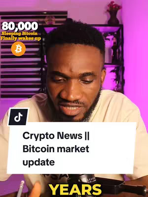 The cover image features a close-up of a Black man in a light-colored shirt set against a blurry background. Overlay text in the upper left corner displays the number '80,000' above 'Sleeping Bitcoin' and 'Finally wakes up,' accompanied by a Bitcoin logo. A text box at the bottom shows 'Crypto News || Bitcoin market update' accompanied by a TikTok logo in the upper left corner of the text box. The lower portion of the image includes the word 'YEARS'.