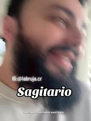 The cover image is a selfie-style video featuring a blurred close-up of a man's face. The background appears to be indoors, and the man has a beard. Text overlayed on the image includes the word 'Sagitario', with the handle of the content creator.