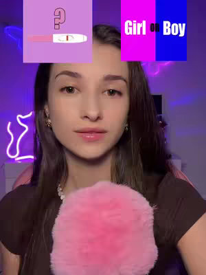 A young woman with brown hair and a light complexion looks directly at the camera, holding a pink fluffy microphone. Above her, two boxes display graphics: one with a question mark and a pregnancy test, and the other showing a pink and blue split background with the words "Girl" and "Boy."