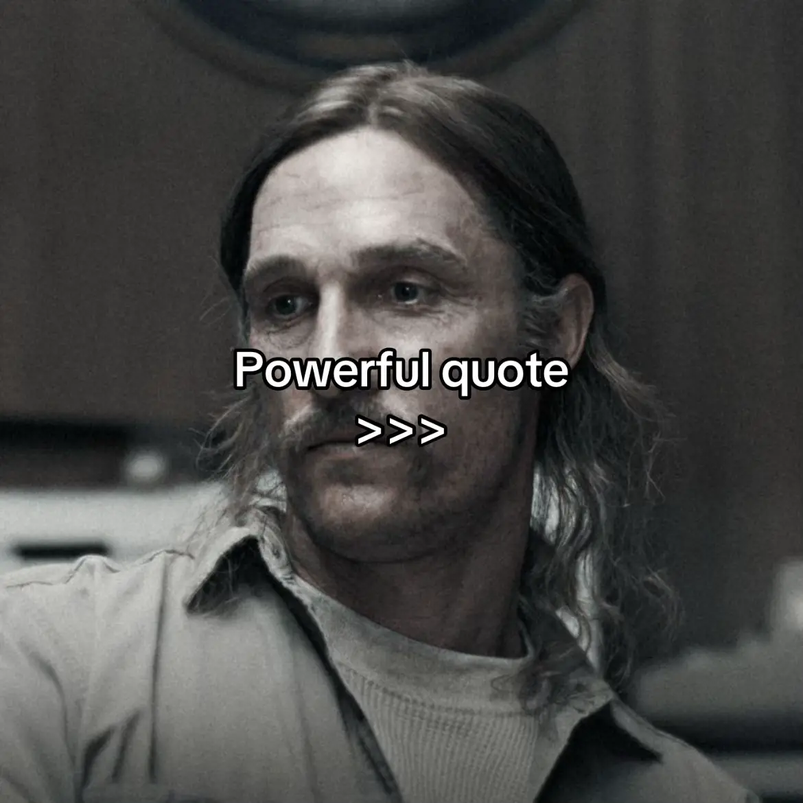 The cover image features a man with long hair and a mustache, likely in his 40s or 50s, facing the viewer. He has a serious expression. The image is in black and white; superimposed on the image is the text "Powerful quote">>>" in a white font and semi-transparent text box is covering the man's face.