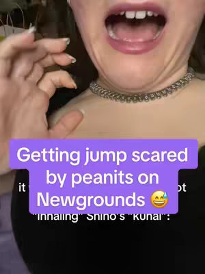 The cover image shows a close-up of a person's face, with their mouth open in what appears to be a scream or surprised expression. A lavender-colored text box overlays the image, with white text stating, "Getting jump scared by peanits on Newgrounds". The person is wearing a silver necklace, and only a portion of their upper body is visible. The background is a dark, undefined color.