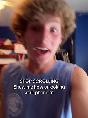 A young man with curly blond hair is centered in the frame, looking directly at the camera with an open mouth as if mid-sentence. Overlaying the image is white text asking viewers a question on the lower portion.