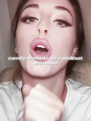A selfie-style shot featuring a woman with a dramatic makeup look. Her eyes are wide, and her lips are open, possibly mid-speech. A text overlay states 'camilla wants to do a podcast with huda'.