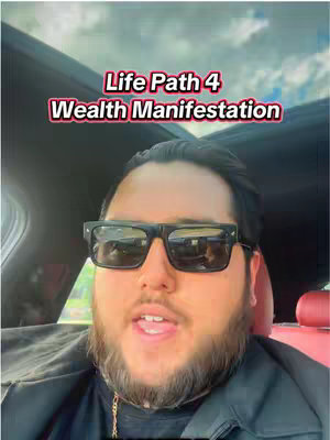 A man wearing sunglasses sits in the driver's seat of a car, with a text overlay on the image.