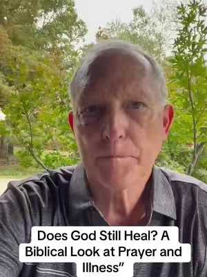 A middle-aged man is centered in a selfie-style shot. The background is blurred, showing greenery, and the man is wearing a dark gray collared shirt. Text overlays at the bottom of the image.