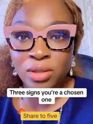 The cover image is a close-up of a woman's face wearing large square glasses. She has light skin and is looking directly at the camera with a neutral expression. Her lips are a natural pink color, and she has on large earrings. The background is blurred out and has pastel colors. There are two text overlays.