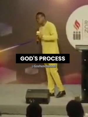 A man in a yellow suit speaks into a microphone on a stage. Text overlayed says "GOD'S PROCESS @Goshenchannel". The background is blurred with warm lighting.