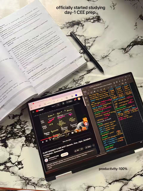 The image shows a study setup with a laptop displaying a YouTube video on plant diversity, an open textbook, and a pen on a marble-patterned surface. Text overlays indicate the start of CEE exam preparation.