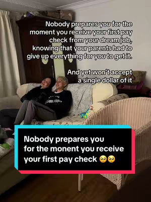 A candid photo shows two women sitting on a couch. Text overlays on the image convey emotional themes related to a first paycheck.