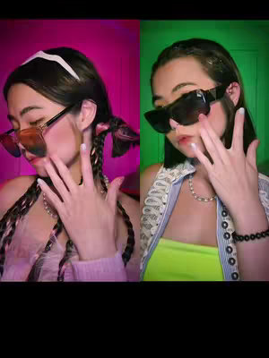 Two split-screen portraits of a person facing the camera, with the right side having a green background and the left a pinkish hue. The person in both sections is wearing sunglasses and making a hand gesture as if touching their face. They each have different outfits and hairstyle.