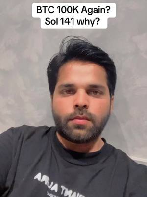 A man faces the camera with a curious expression in front of a light gray background. Above him is a white text overlay with a question about Bitcoin and a mention of Solana's price. The man is wearing a black t-shirt with white text on it and has a well-groomed beard and dark hair.