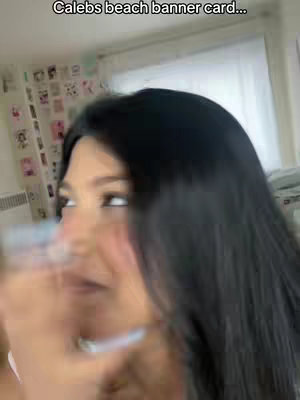 The cover image features a person with long black hair, seen from the side in a blurred, close-up shot. The person is looking off to the side, with a soft focus and potential pink hue around the face.