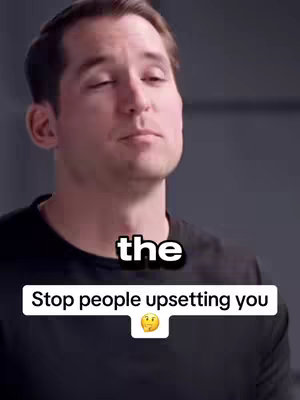 A man with short brown hair in a black shirt looks upwards with a neutral expression. Below the man, a white rectangular box features the text, "Stop people upsetting you" in black font. Below this is a single, small thinking face emoji. A white square text overlay above says "the". The background has a neutral grey tone.