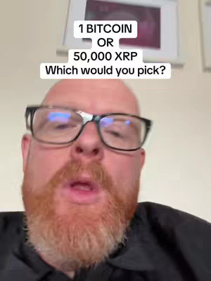 A man with a beard wearing glasses is positioned from the chest up. Text overlays prompt viewers to choose between 1 Bitcoin or 50,000 XRP. The background shows an out-of-focus indoor setting.