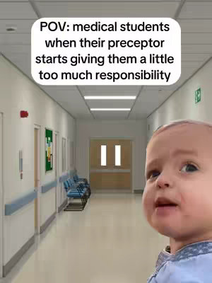 The image shows a hallway in a bright building, likely a hospital or medical facility. The hallway is long and has white walls, with doors and wall-mounted handrails along the sides. Blue chairs are visible next to a green notice board. At the end of the hall is a light-filled area with a double door. In the foreground, a baby's face is superimposed. The baby has a surprised expression, with eyes wide open. The text overlay reads 'POV: medical students when their preceptor starts giving them a little too much responsibility'.