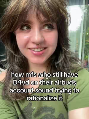 The cover image features a close-up of a person with brown hair and a nose ring, smiling slightly. The person is wearing a greenish-olive colored shirt. Text is overlaid, written in a white sans-serif font, that states 'how mfs who still have D4vd on their airbuds account sound trying to rationalize it'.