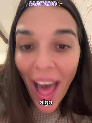 A close-up shot of a woman with dark hair and a surprised expression, mouth open. Text overlays, "SAGITARIO" at the top and "algo" at the bottom.