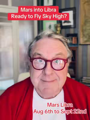 A man with a kind expression and glasses is the main focus of this image. Text overlays in the image provide context and additional information about Mars entering Libra.