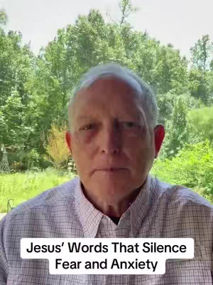 A medium shot features a fair-skinned older man centered in the frame. He has short, nearly white hair and is wearing a button-down shirt, the top button undone. The background includes lush green trees. A white rectangular text box at the bottom displays the words "Jesus' Words That Silence Fear and Anxiety".