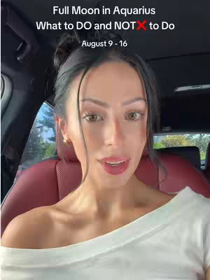 A woman with dark hair is seated in a car, facing the camera. She has a slight smile and is wearing a white top. Behind her is a car interior with red accents. Above her is text overlayed on the image.