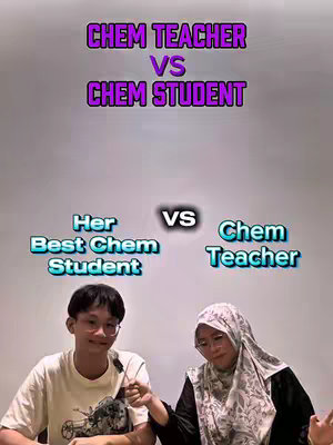 The cover image shows a split screen. The top half has the text 'CHEM TEACHER VS CHEM STUDENT' in purple and white text that is bubbly. The bottom half has two individuals with the text 'Her Best Chem Student' on the left and the text 'Chem Teacher' on the right with a 'VS' in the center. On the left is a young male with glasses and a t-shirt and on the right is a female wearing a hijab and glasses.