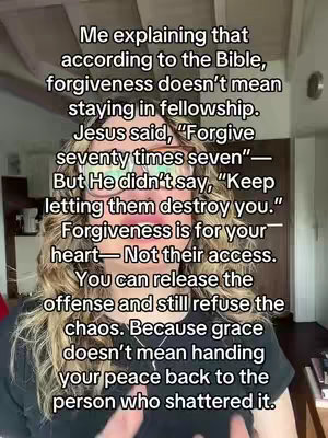 A woman with curly blonde hair and glasses is centered in the frame, with text overlaid on the image. The background is slightly blurred, suggesting an indoor setting.