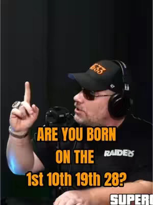 A man in a black Raiders hat and sunglasses, a black shirt, and headphones is pointing up with his right index finger. Text overlay asking about birth dates. The background is a solid dark color. The overall impression is that of a podcast setup.