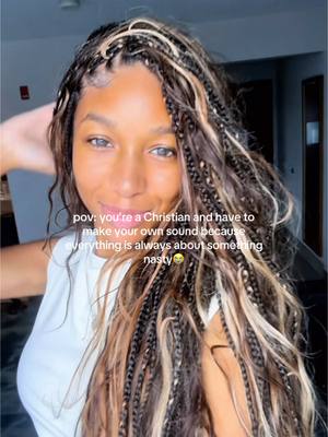A close-up of a young woman with long, multi-colored braids. She is smiling slightly and looking at the camera. Overlayed text reads 'pov: you're a Christian and have to make your own sound because everything is always about something nasty'.