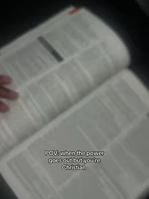 An open book is in the foreground, the pages are white and printed on, with some annotations. In the center of the image there is a text overlay.