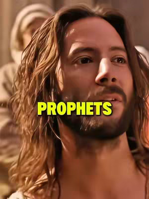 The cover image is a medium shot featuring a man with long, brown hair and a beard. The man is looking slightly to his right, and his expression is thoughtful. A yellow text overlay reading 'PROPHETS' is prominently displayed across his face. In the background, a blurred figure wearing a light-colored head covering is partially visible. The overall image is warm-toned, with a focus on the man's face and expression. The lighting appears to be natural, and the composition is simple, drawing attention to the main subject.