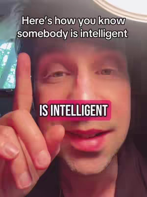 A close-up shot of a man looking towards the viewer, pointing. Text overlays his face, with a pink background, adding context to the video's subject.