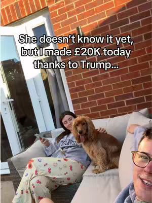 A selfie taken from an outdoor patio. A woman is seated on a sofa, a dog next to her. A person is partially visible in the frame. Text is overlaid on the image.
