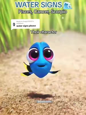 The image features a cartoon character, the blue fish Dory from "Finding Nemo," hovering against a softly blurred background suggesting sand and greenery. Text overlays indicate the video focuses on astrology, relating to water signs like Pisces, Cancer, and Scorpio. The character has large, expressive eyes and a friendly, inquisitive expression.