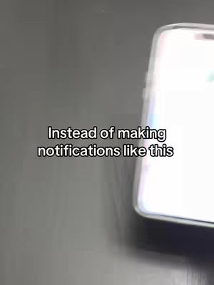 A close-up shot of a smartphone on a dark surface. The phone is slightly angled, with the screen illuminated and displaying an interface. Overlaid text is positioned above the phone, providing context or a tutorial prompt.