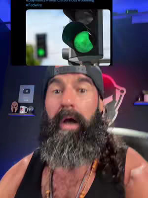 The cover image features a man with a beard and a surprised expression. Above him is a screenshot of a Twitter post showing a green traffic light, suggesting a 'go-ahead' signal. The man is in front of a dark background, seemingly recording a video.