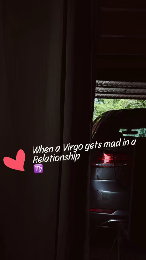 The cover image shows a dark indoor scene with a car parked in a garage opening. A partial view of the car's rear is visible, and text overlaid in stylistic white font reading When a Virgo gets mad in a Relationship. A pink heart is present next to a Virgo symbol.