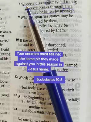 The image shows an open Bible with a pen pointing to a highlighted passage, with overlaid text in a colored box.
