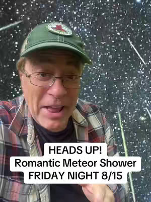 A man wearing glasses, a green baseball cap, and a plaid shirt is the focus. He is facing the camera and speaking. Behind him is a starry, dark background with streaks of light.